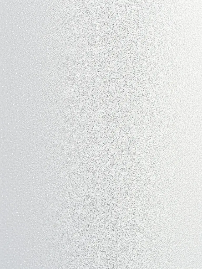 A close-up shot of a wall finished with Fyqon's Aura collection, showcasing its subtle shimmer and elegant texture under soft, diffused lighting.