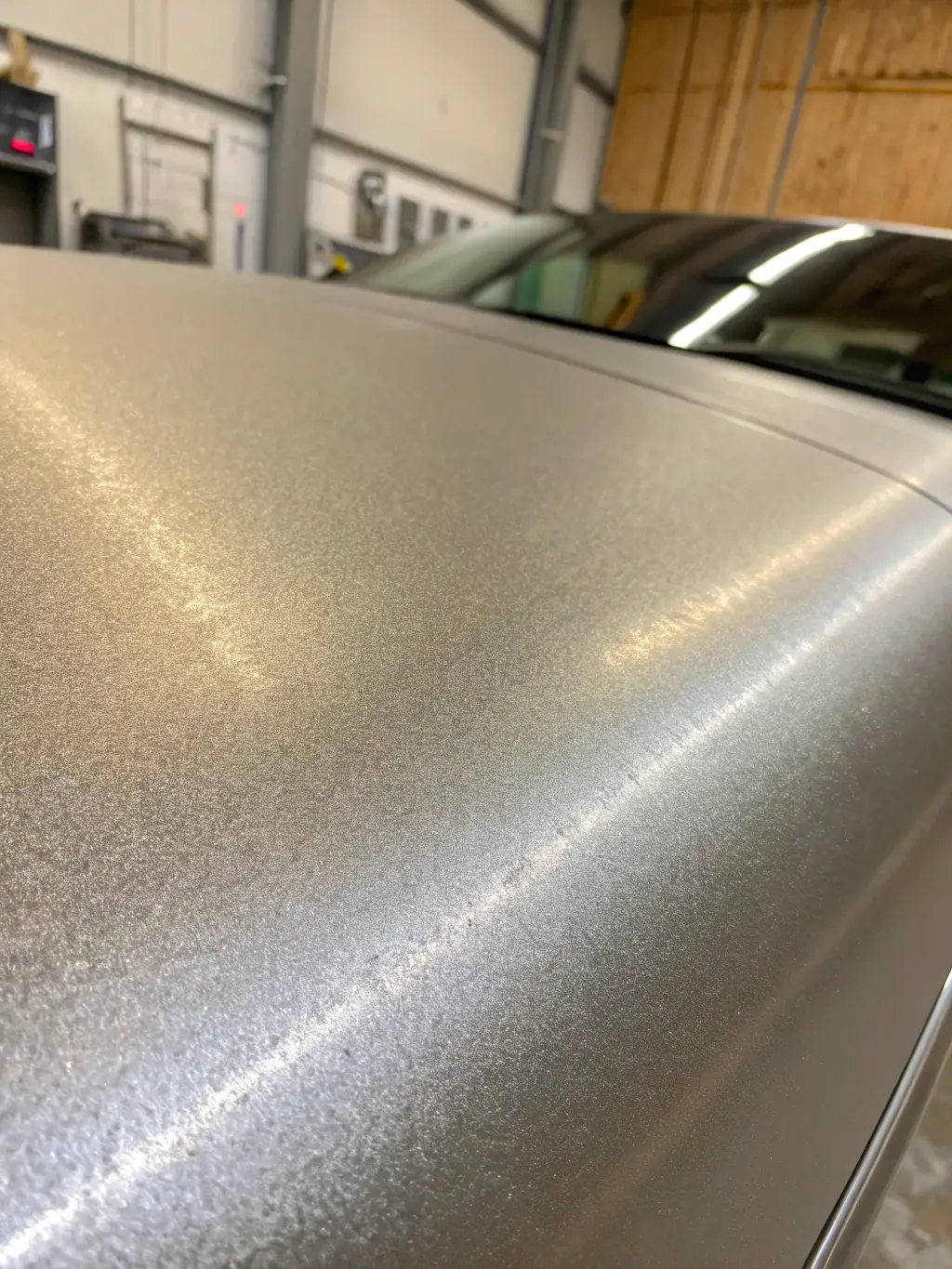 A close-up shot showcasing the scratch-resistant surface of Fyqon's Cemento finish after being lightly abraded with a key, proving its durability.